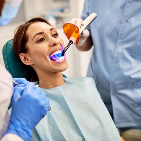 a patient undergoing the tooth colored filling process