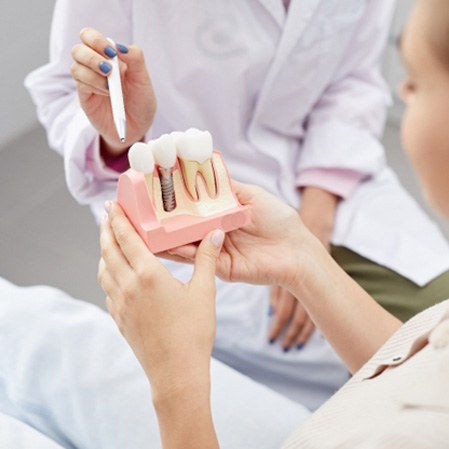 Dentist explaining the cost of dental implants to patient