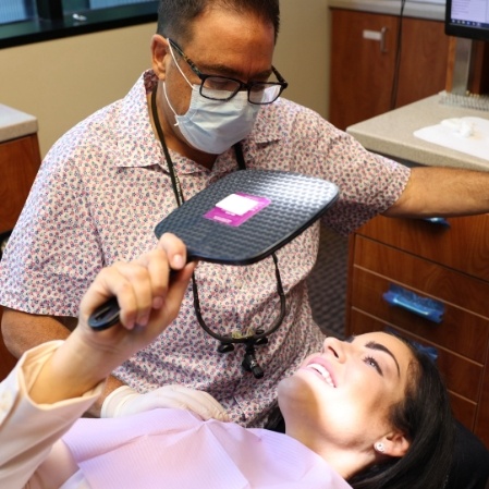 Dentist performing preventive dentistry checkup and teeth cleaning