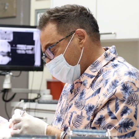 Doctor Sherman offering dental treatment